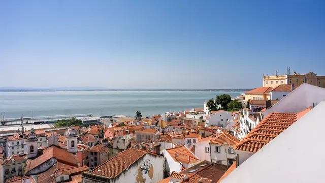 Rooftops of Lisbon's Alfama district and the Tagus River